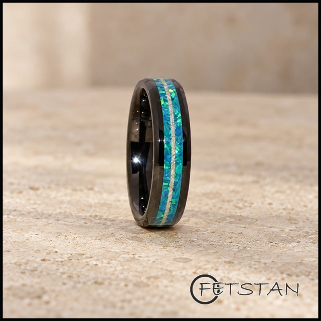 Blue memorial ring with ashes, black base, and topaz-toned opal reflections
